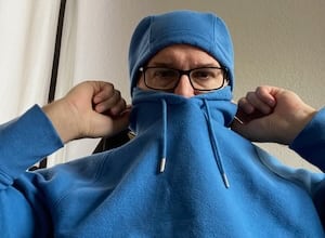 It's me pulling over my hoodie and stretching it across my face. I look like Kick Ass